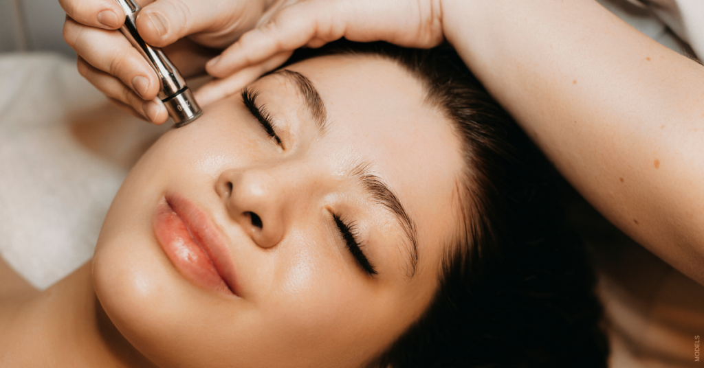 Young woman receiving microneedling