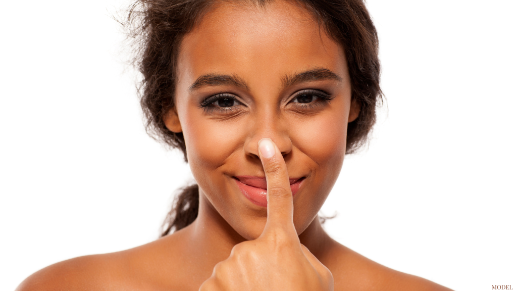 Woman touching nose (Model)